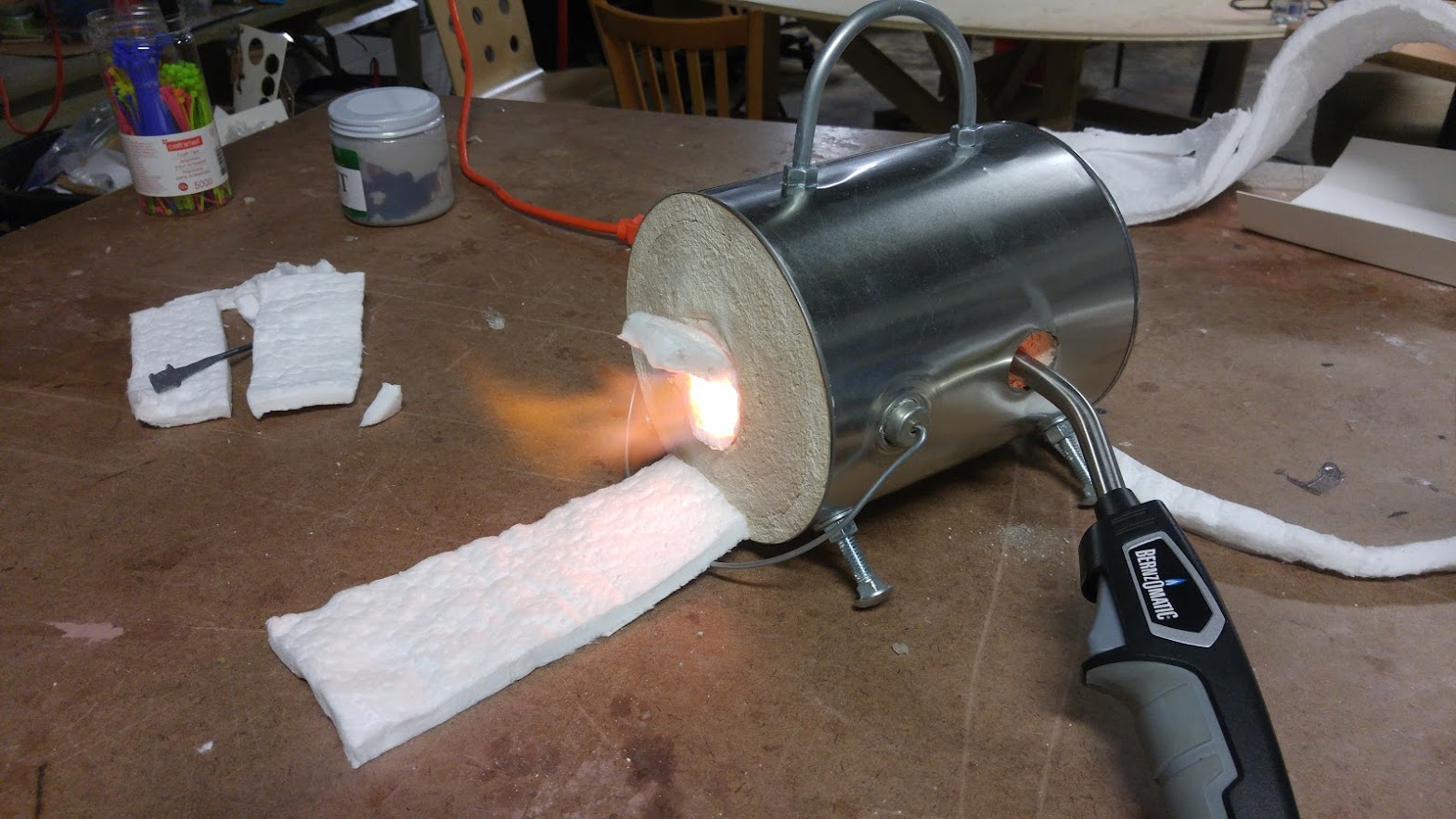 Homemade propane forge glowing with heat