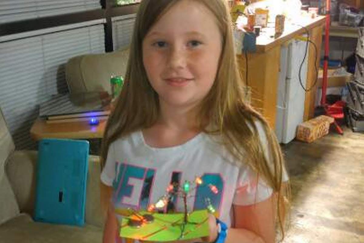 Girl with her LED tree creation