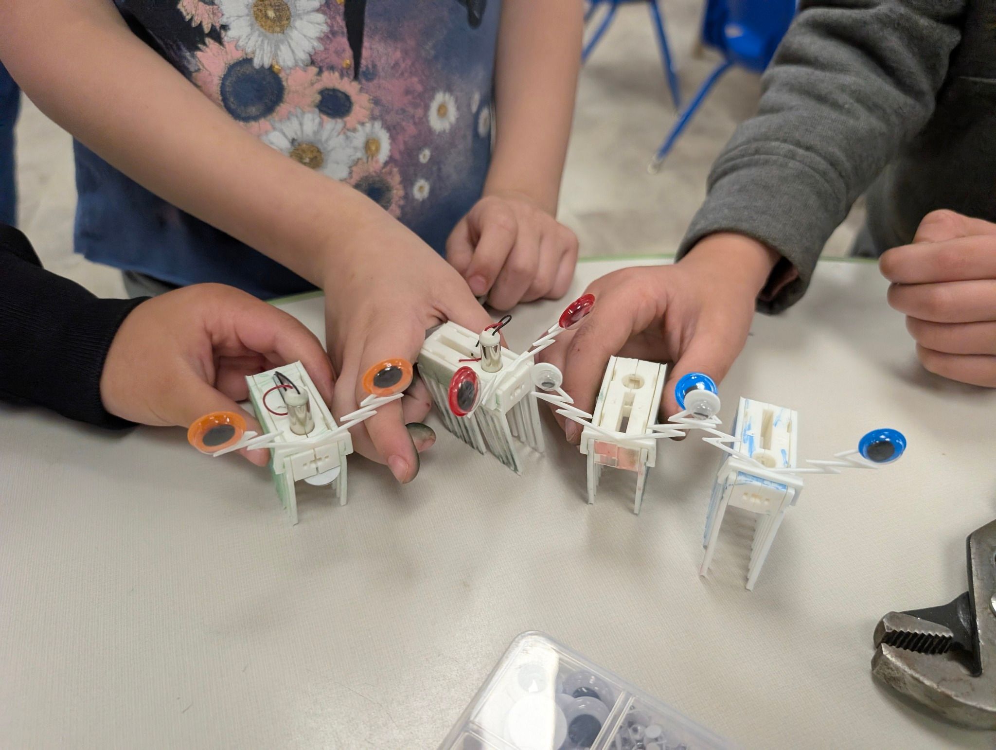 Kids holding their bug bots