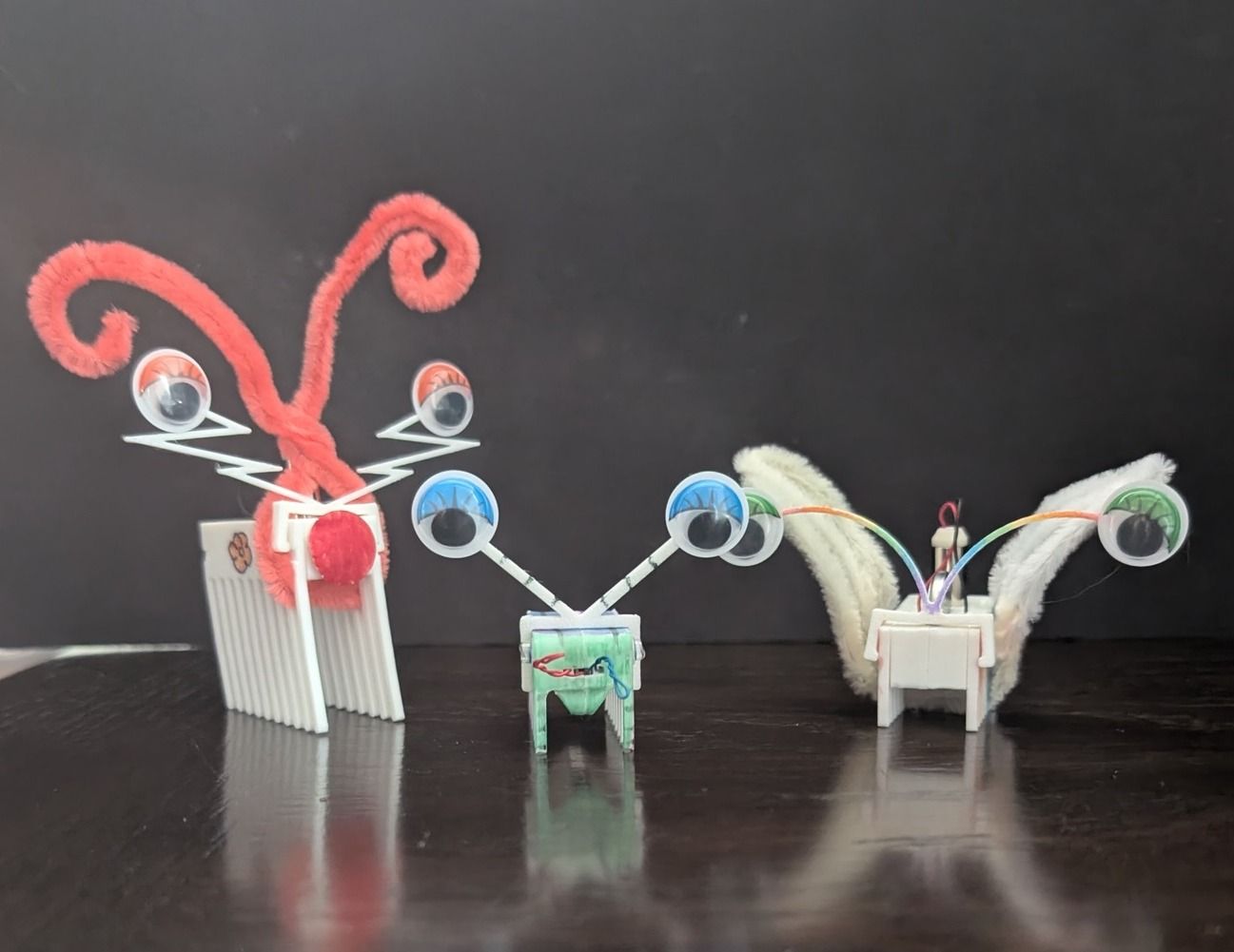 Three decorated bug bots