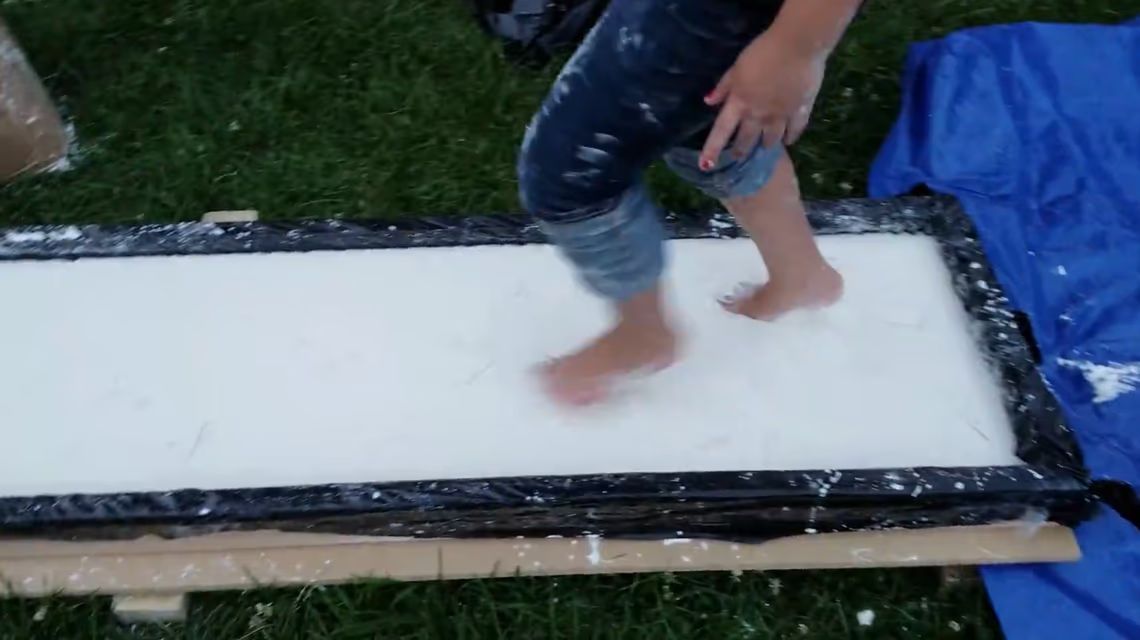 Kids running across oobleck trough