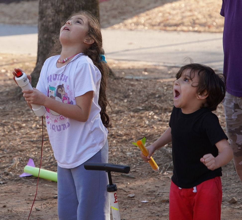 Kids amazed watching their rocket launch