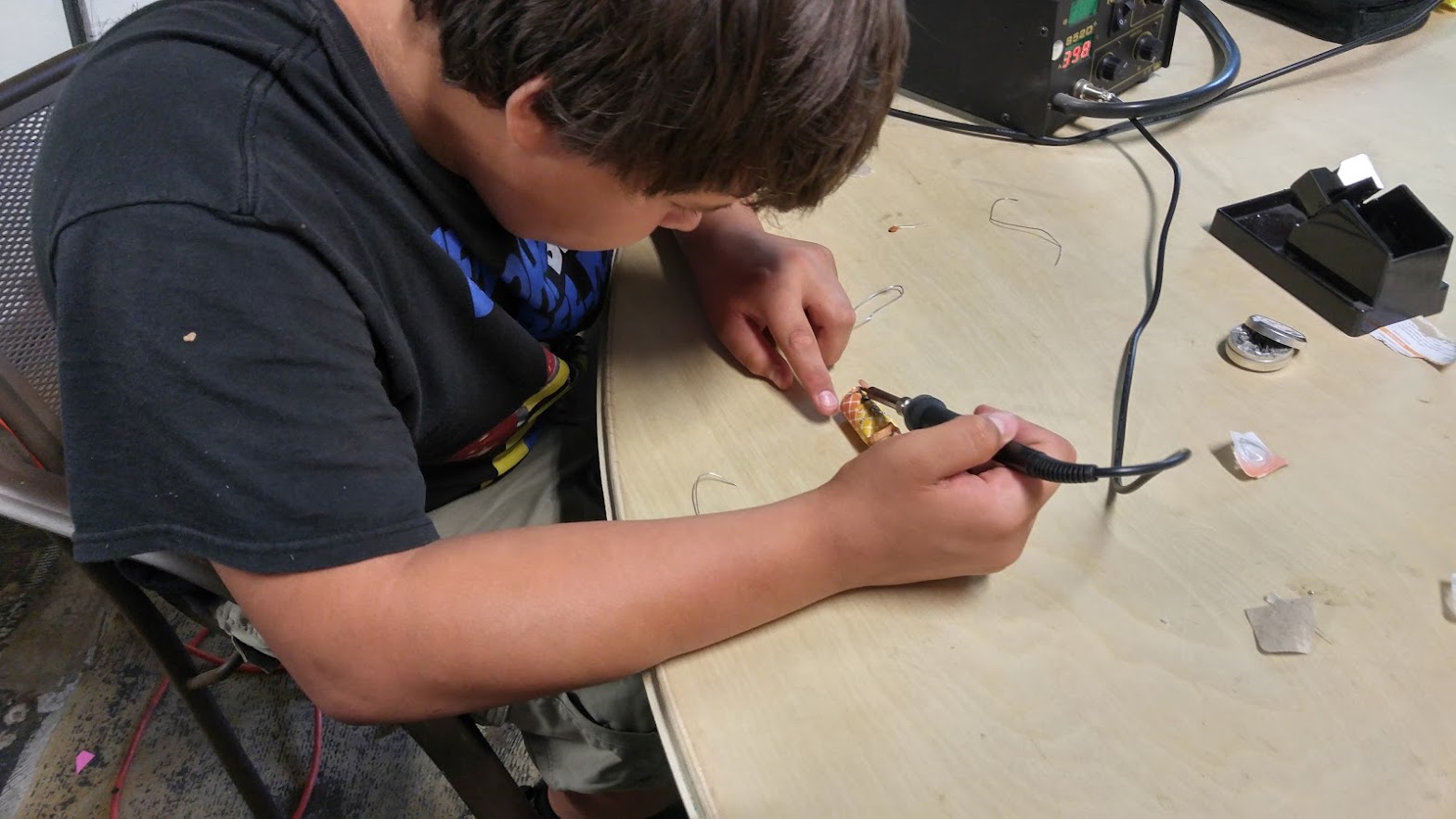Student soldering radio components