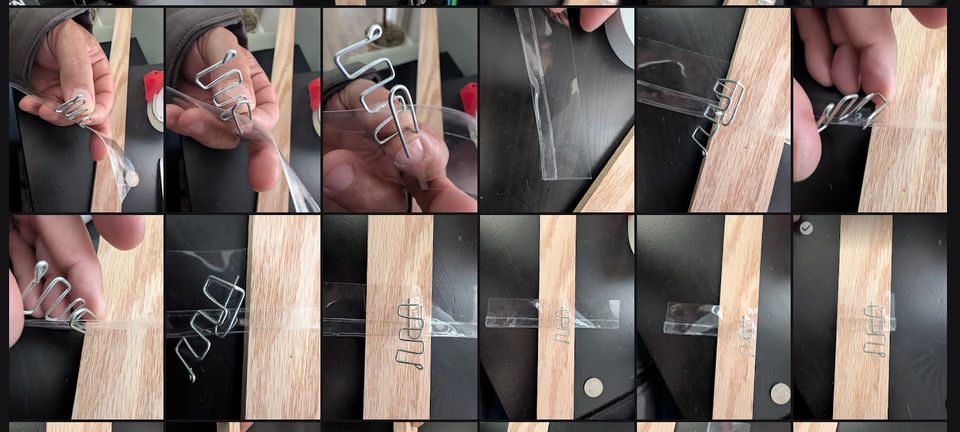 Completed descenders mounted to a wooden paint stirrer test rig with clear tape