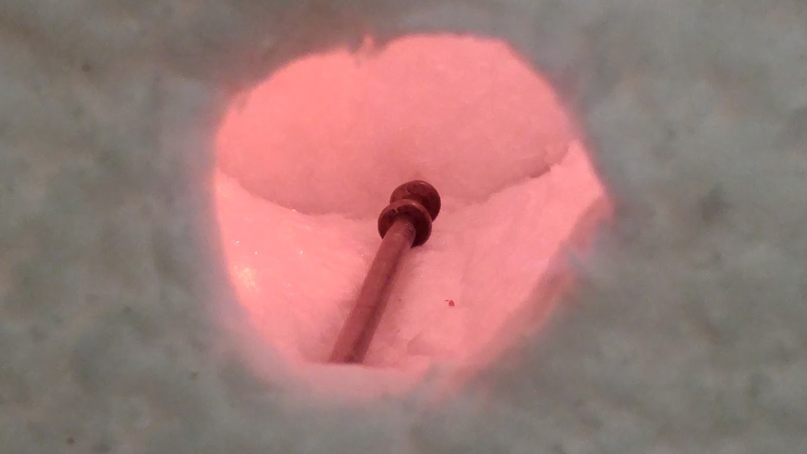 Metal heating in forge showing orange glow